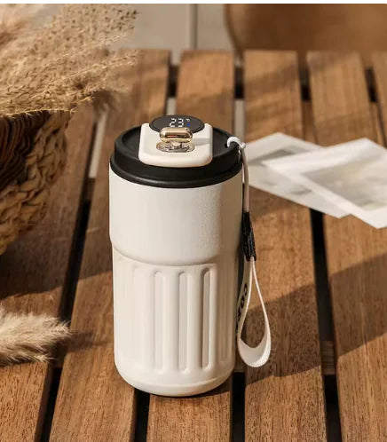 Smart Digital Thermal Bottle with LED temperature display on a wooden table, perfect for on-the-go hydration.